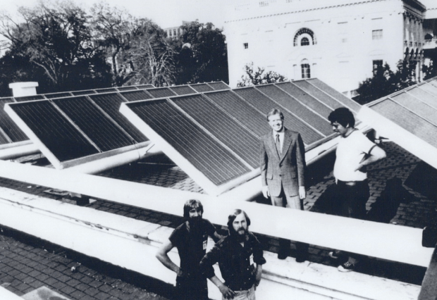 President Jimmy Carter at installation of solar panels on White House. President Ronald Reagan removed them in 1980, the kick of to an awful decade in American history. 
